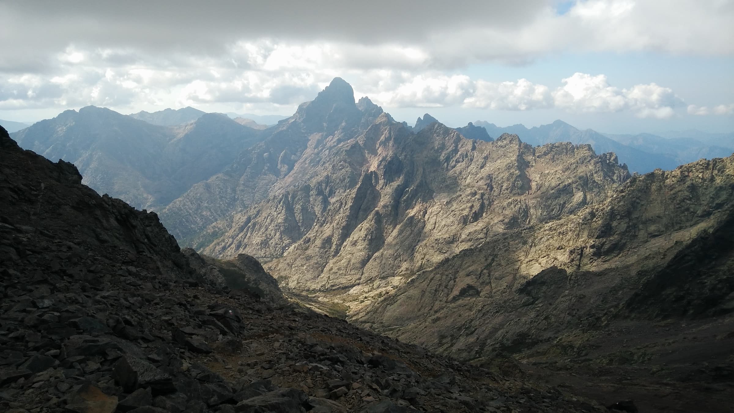 Jagged granite ridges under a hard sky