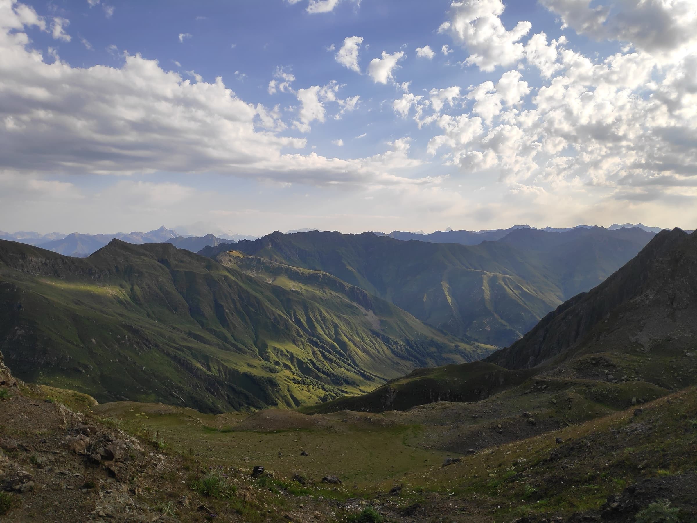 Morning light over layer after layer of green valleys