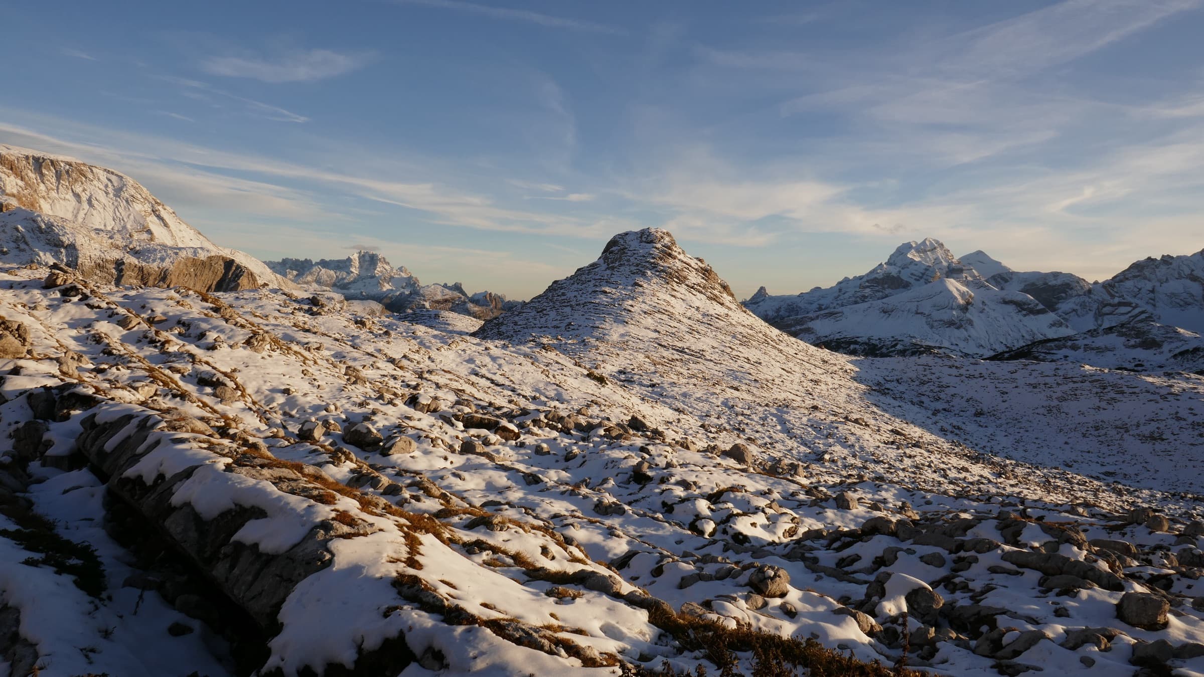 Evening light on a snow-dusted rocky ridge